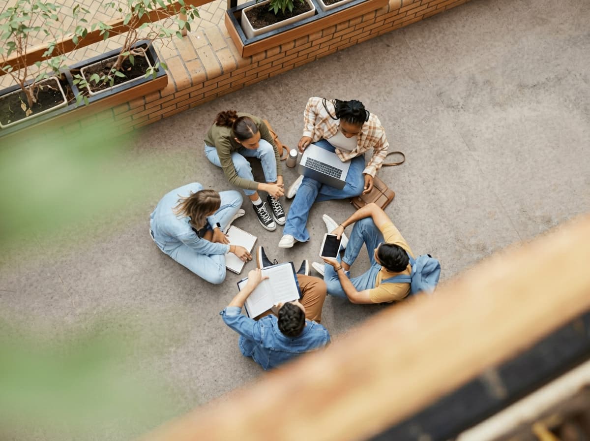 An overhead view of students studying together around a table.