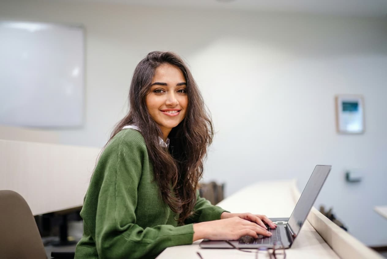 An adviser guiding a student through UK application steps.