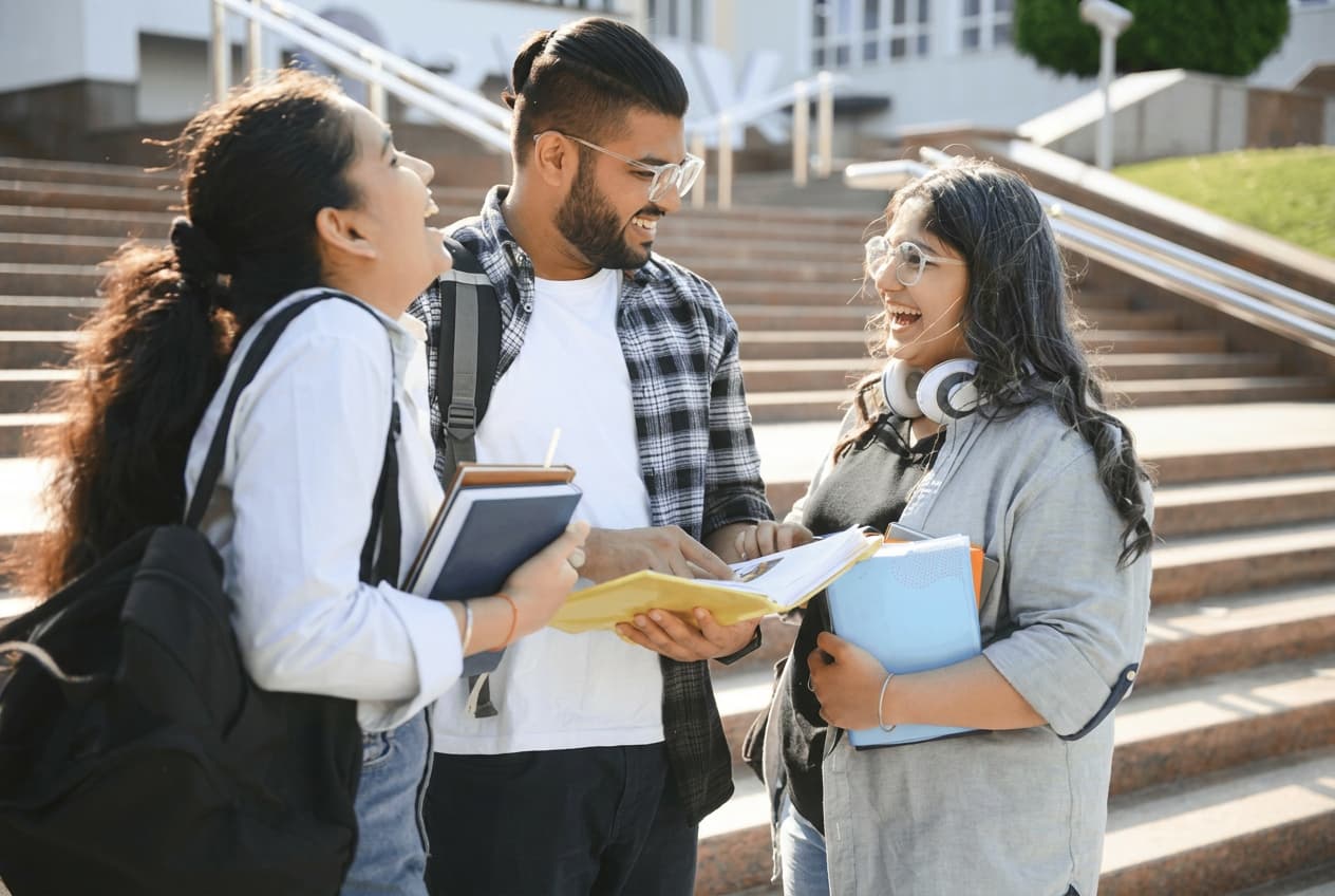 A mentor and student working through a study abroad guide.