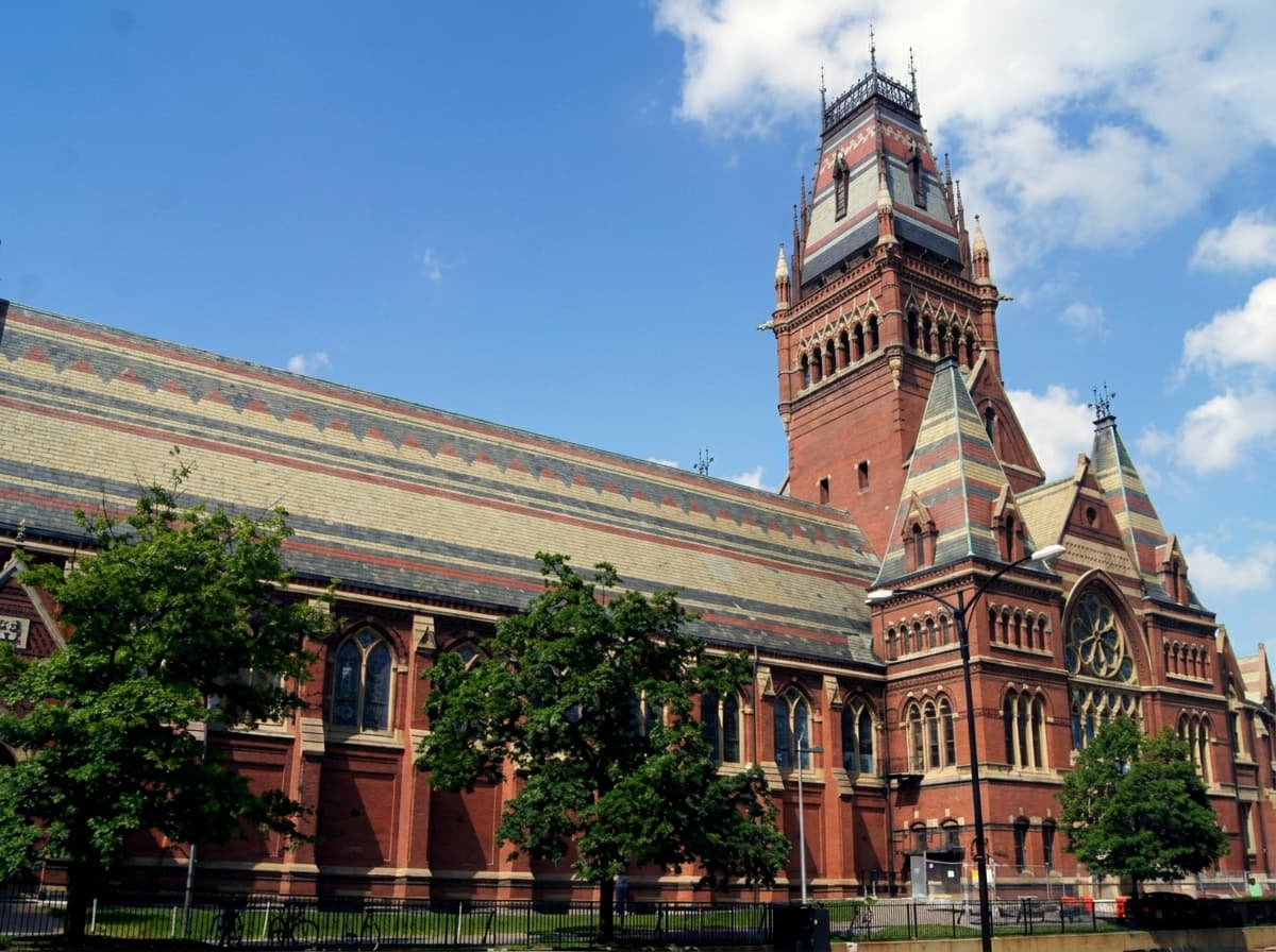 Harvard Memorial Hall against a blue sky.